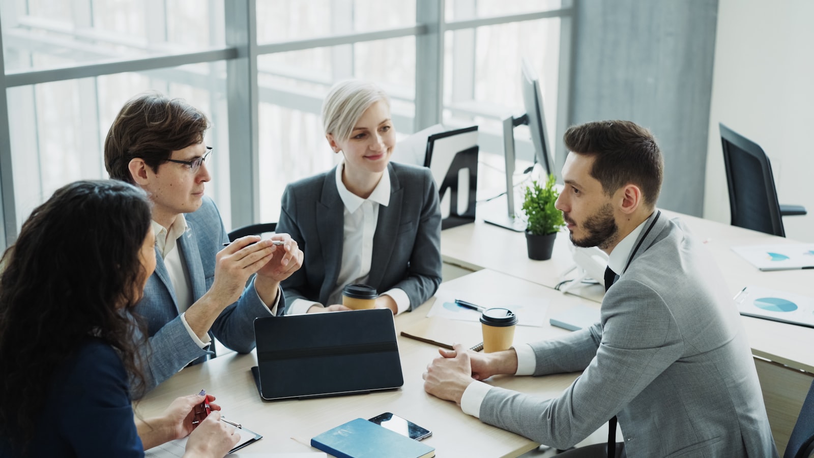 Business professionals meeting in a modern Vienna office